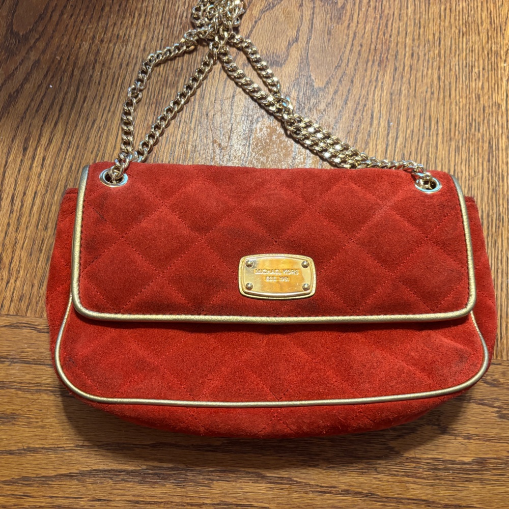 Michael Kors, red and gold velvet quilted chained handbag.